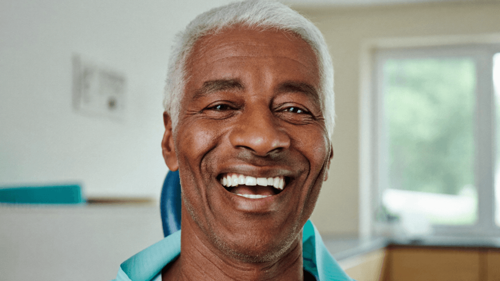 Happy mature UK dental patient smiling after full-arch dental implants in Antalya, Turkey